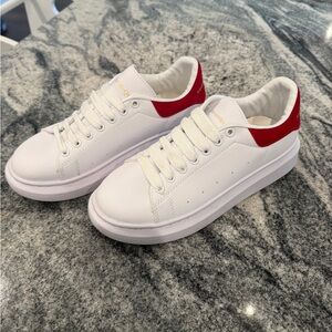 White Sneakers with Red Detail